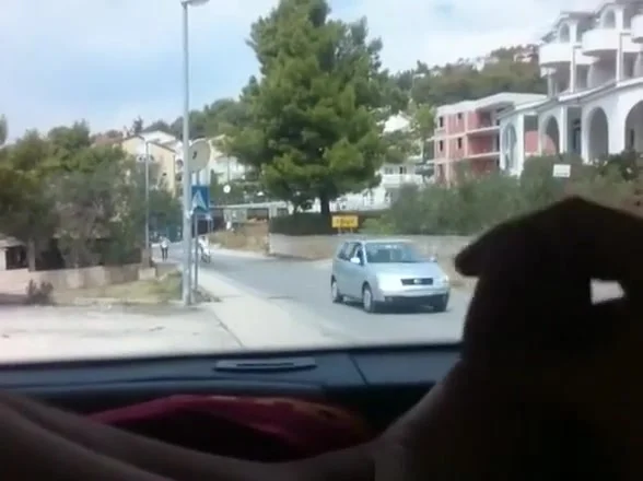 Exhibitionist dude plays with his cock in the car trunk