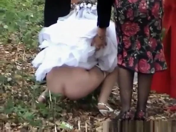 Bride needs help with dress to not piss on it
