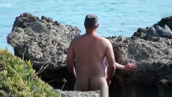 Sex by rocks on the beach