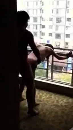 Filming his wife gets fucked at open window