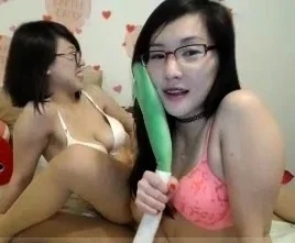 Asian teen lesbians with pigtals give cunnilingus