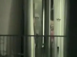 Peeping through hotel bedroom window