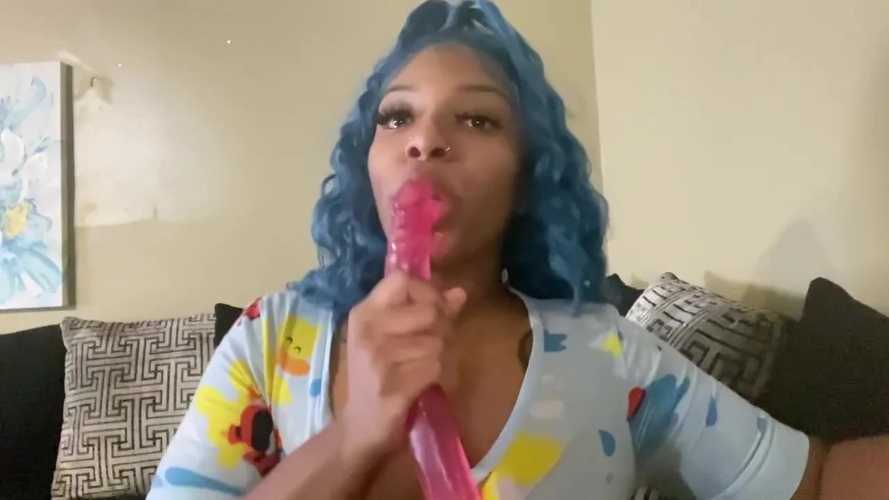 Ebony With Blue Hair Having Fun On Couch