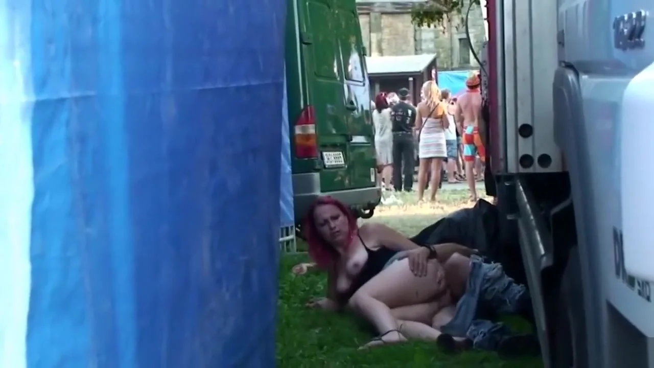 punks caught copulating outdoors behind two trucks