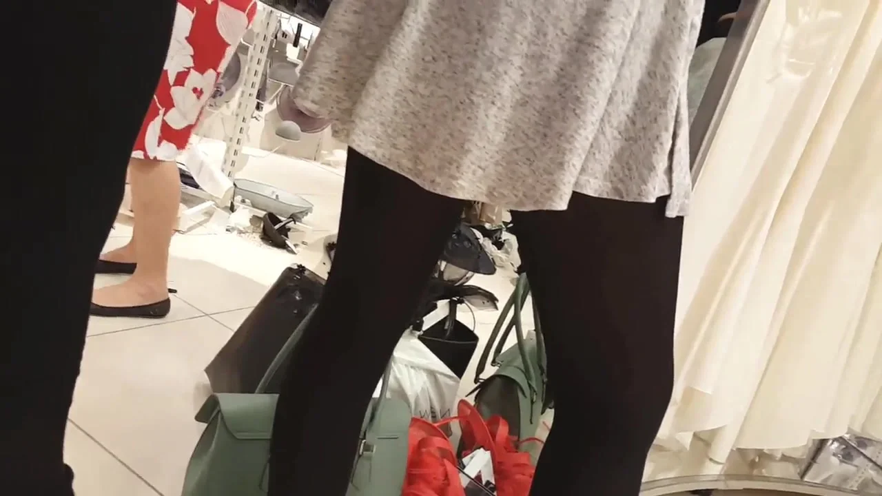 Sexy girl in super mini skirt and black tights