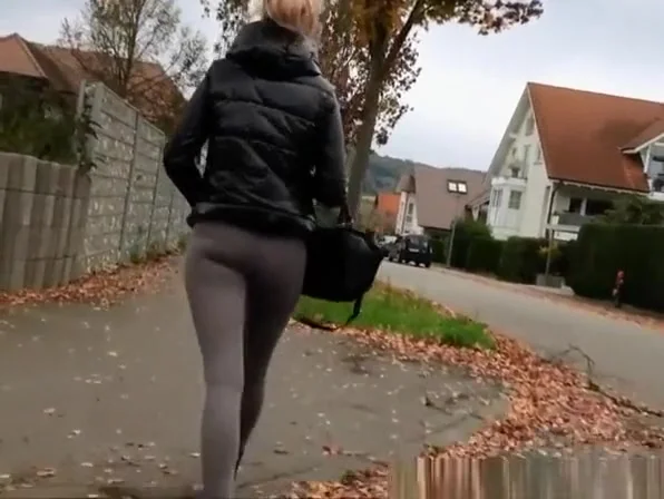 Blonde woman wearing dark grey leggings