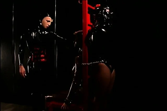Fine slave girl gets tied down to a table and bound in latex