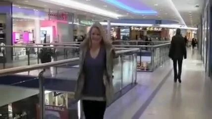 Exhibitionist Woman Gives Blowjob in Dressing Room at Mall