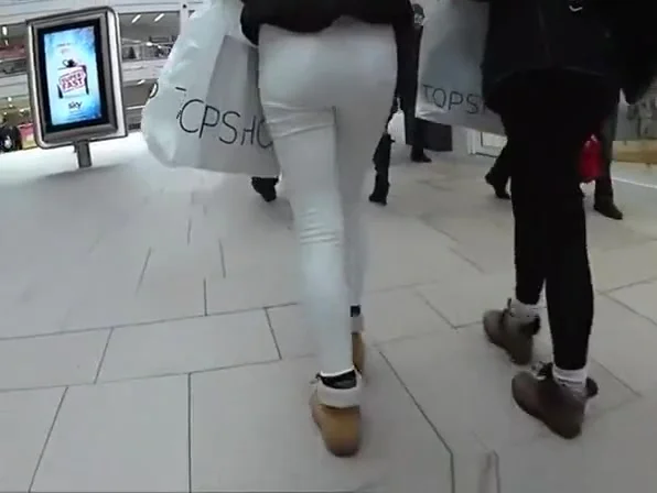 Girls in tight jeans pants walking in the street