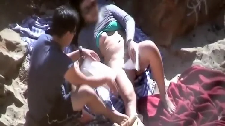 Shy couple fucking on a beach