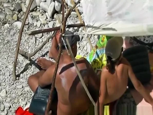 Bald nudist man fucks wife next to water