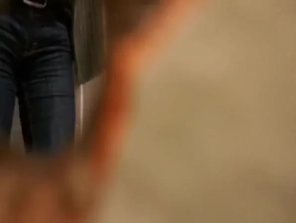 Woman takes a pee in public toilet