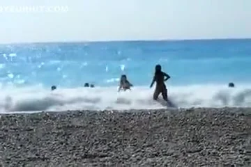 Accidental nudity shown in wavy water