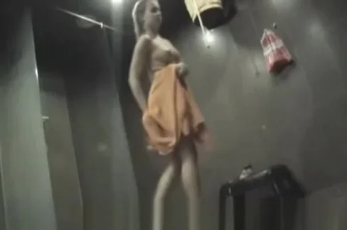 a crowd of naked women washing in the shower