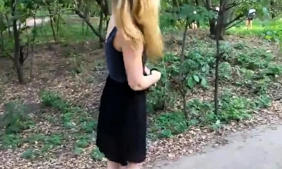 Girl walks in the Park with naked booty