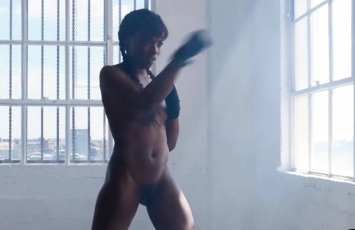 Small tits black pornstar posing naked