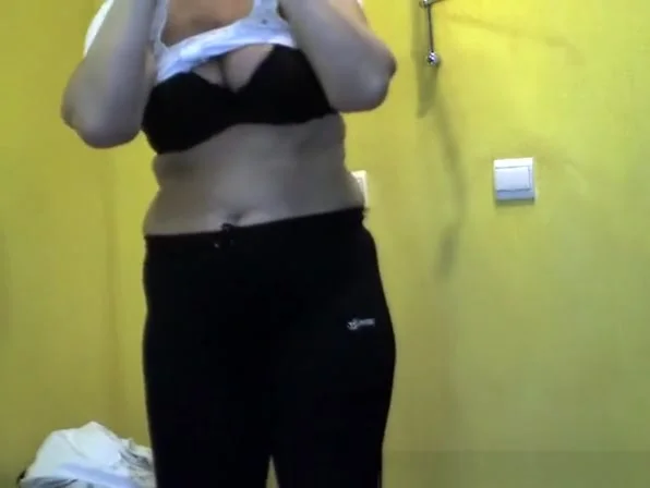 Short hair mature woman undressing and dressing