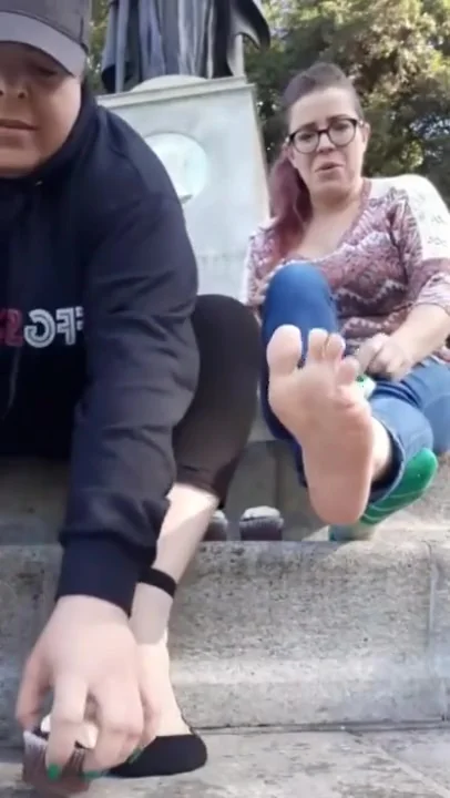 Girls crushing cupcakes in the park