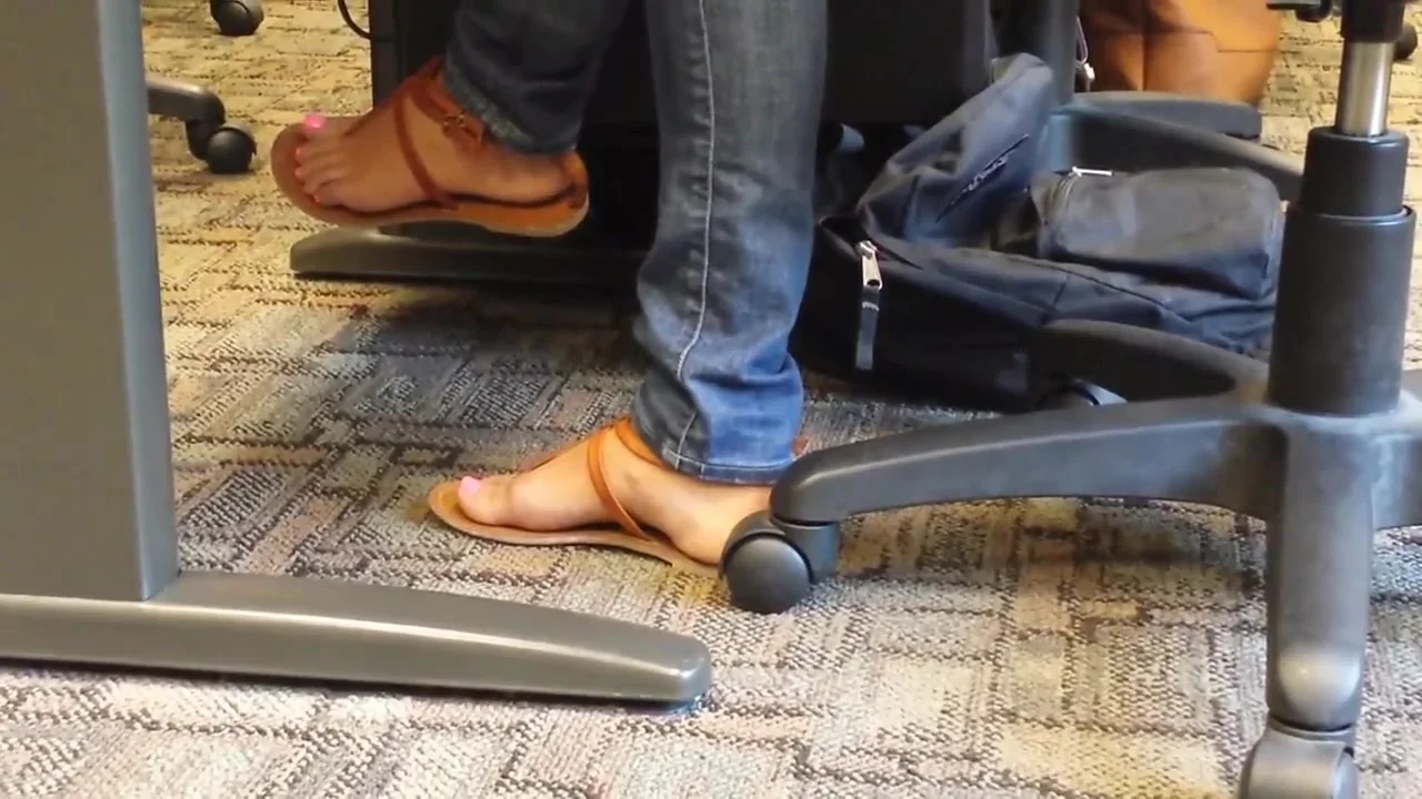 Sexy college teen 18+ pink nails feet in class