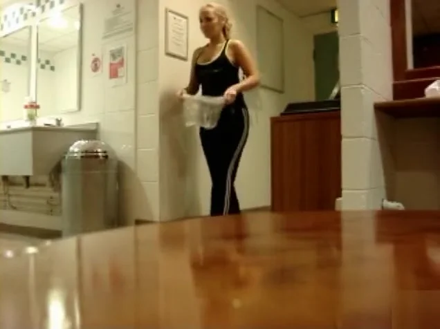 Pretty blonde takes a piss into the nylon bag
