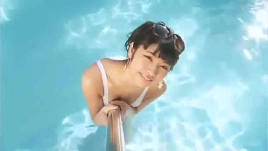 Sexy asian girl wearing heels in the pool.
