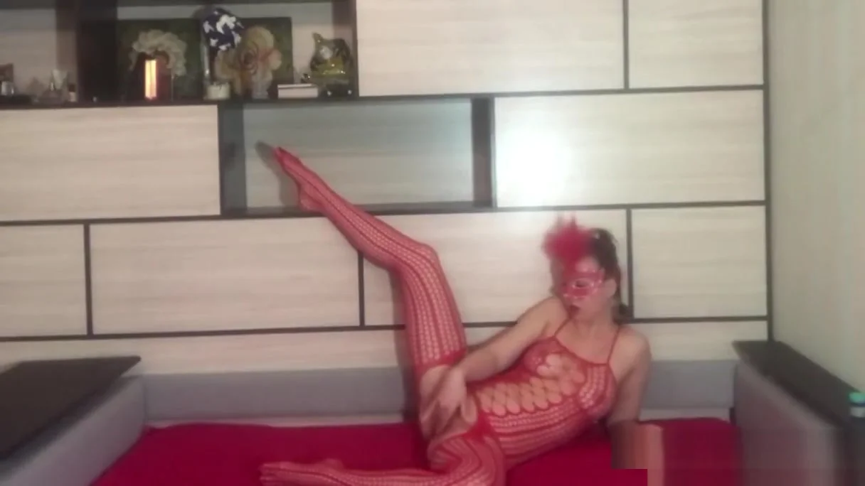 Amateur striptease in red fishnet full bodysuit stockings and clit rubbing