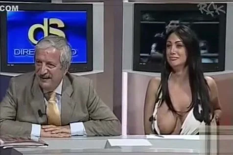 Italian woman flashes her giant tits on TV show