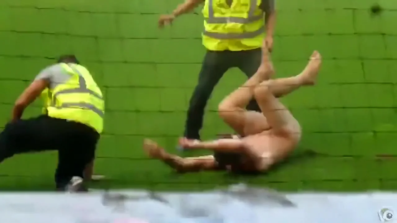 Nude maniac runs around the football field