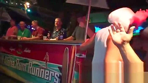 Slutty pierced girl stoves a bottle up pussy at fantasy fest