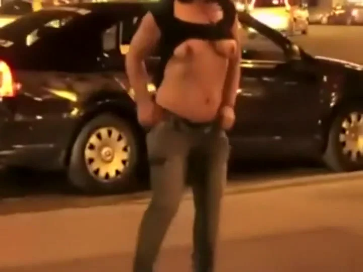 girl stripping in front of a club
