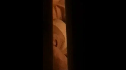 through window - mature couple masturbates each other