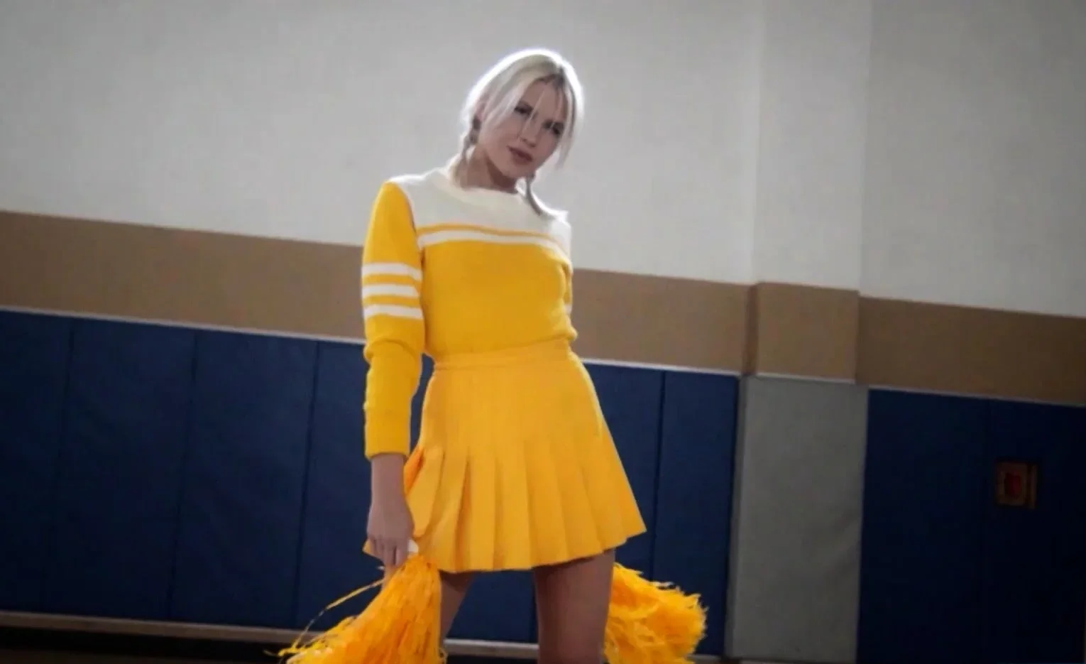 Petite blonde MILF cheerleader stripping