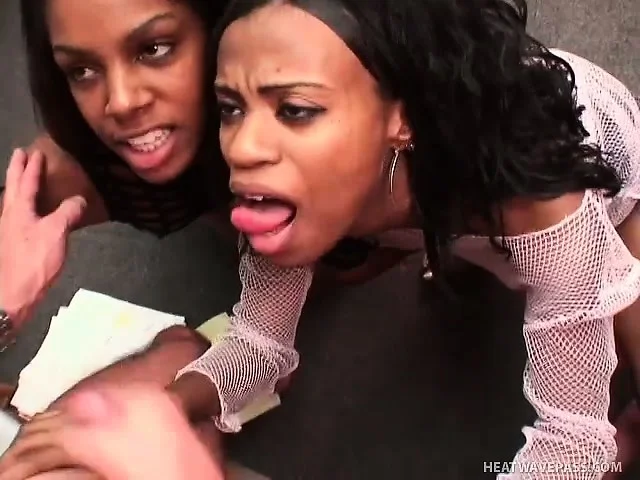 Two feisty ebony eye candies go down on a lucky guy's rigid fuck rod