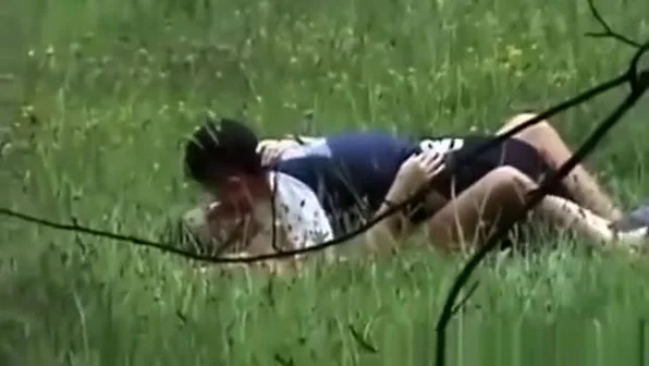 A boy with a girl having sex on a public place