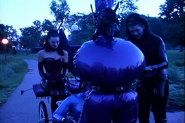 Public training of latex-clad femdom slaves gets really kinky