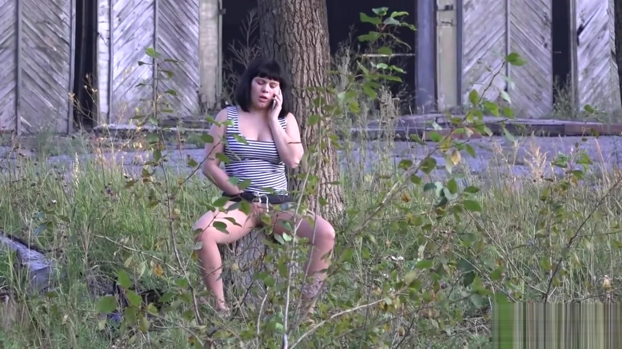 The girl masturbates in a public place