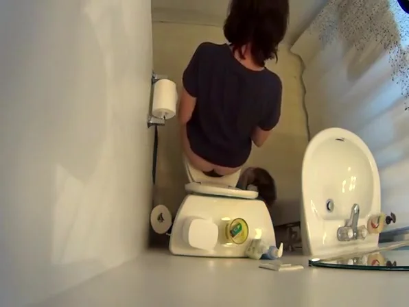 over the toilet catches woman peeing