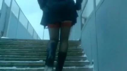 Chick in red tops stockings going upstairs