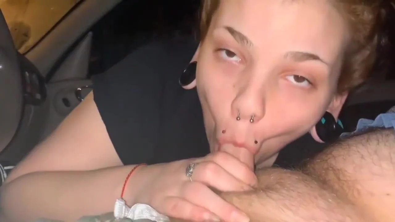 Slutty redhead gives sloppy head in public.