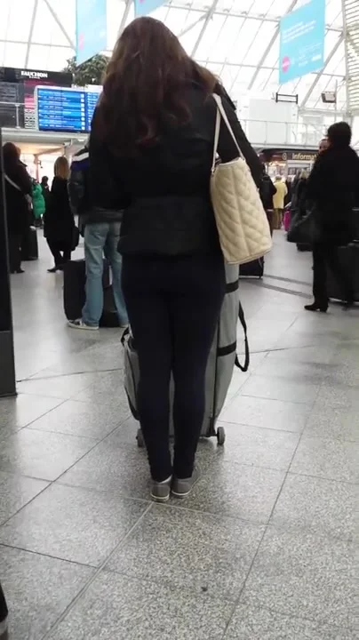 Candid street, shiny jacket and blue leggings
