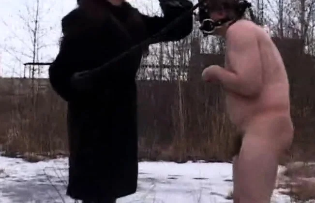 Evil MILF having fun humiliating slave in the snow
