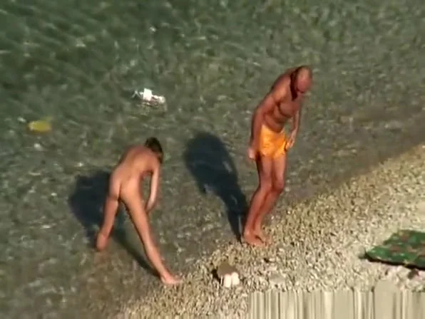 Nude woman swimming and drinking