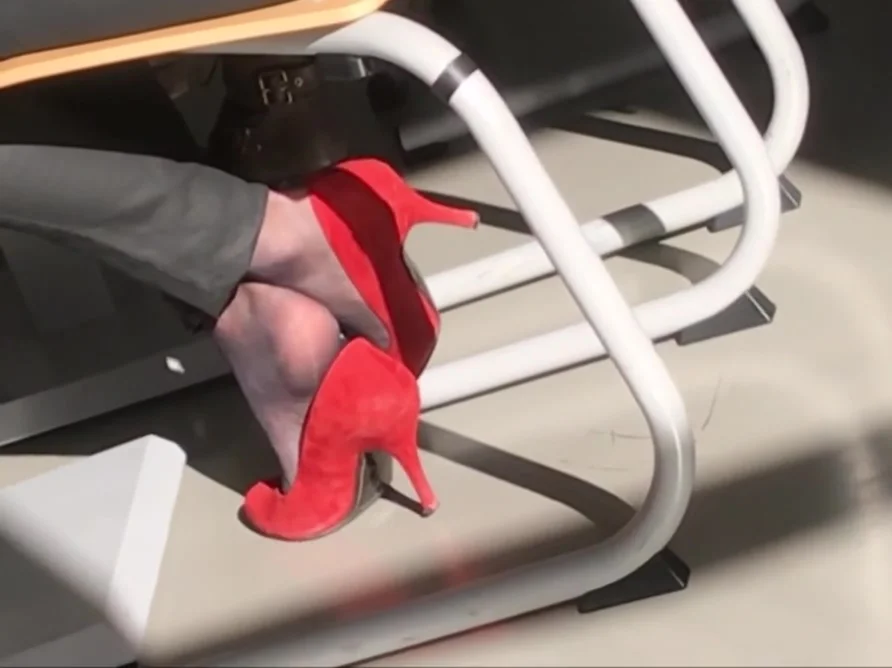 secretary in nylon socks and red high heels