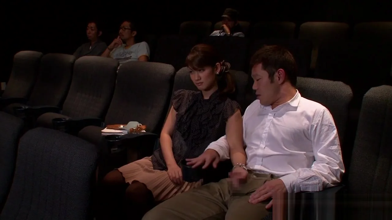 Nippon babe sucks bloke in public theater