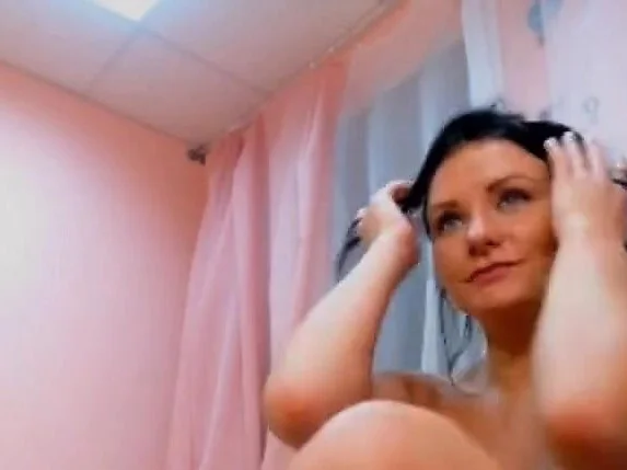 Sexy busty brunette babe with huge tits teasing on webcam