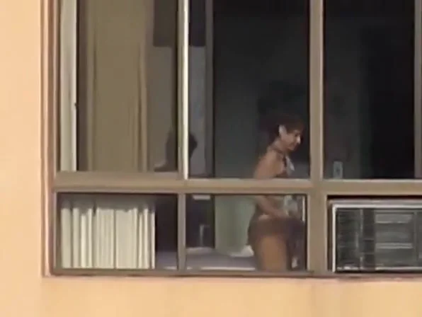Naked mature spied through her apartment window