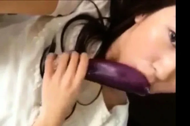 hot korean teen masturbates using eggplant