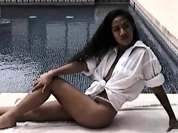 Cute little Noy is out by the pool posing and showing her nice ass