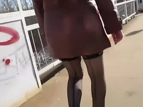 Woman in black stockings going upstairs