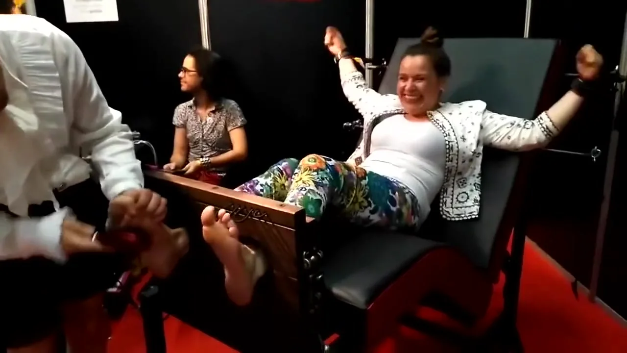Mainstream woman feet tickling in stocks